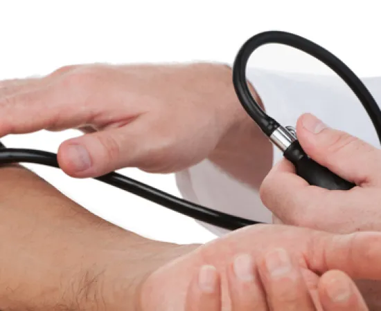 Using a stethoscope to measure someone's blood pressure